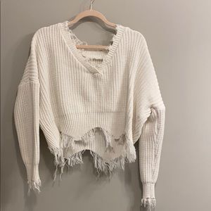 Distressed white v neck sweater